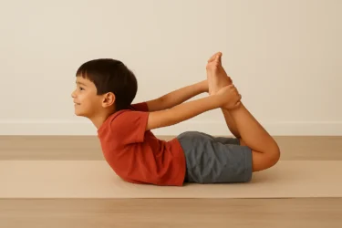 a kid doing bow pose dhanurasana 