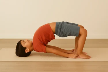 a kid doing bridge pose setubandhasana 