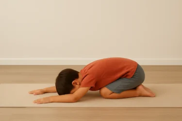 a kid doing rabbit pose shashakasana/ child rest 