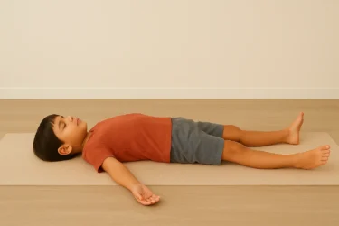 a kid doing starfish relaxation shavasana 